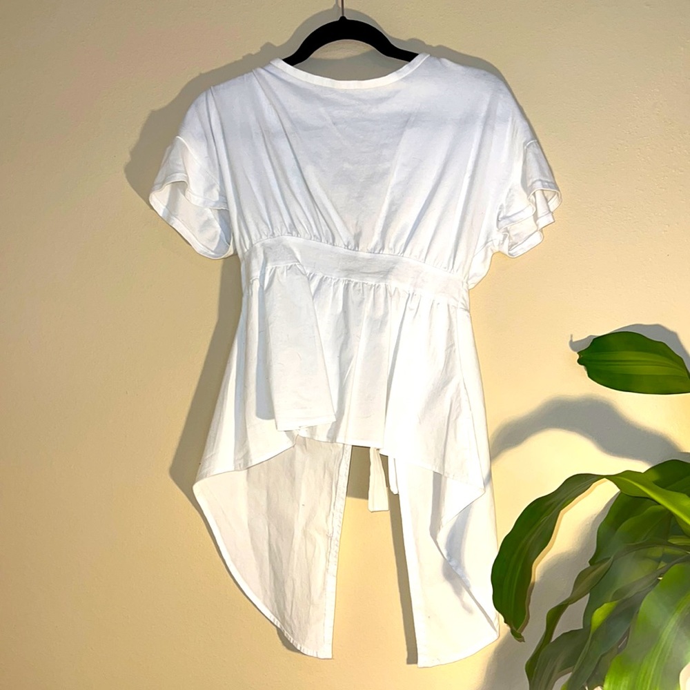 Akira open back white top with bow in back size small Hi-low hem